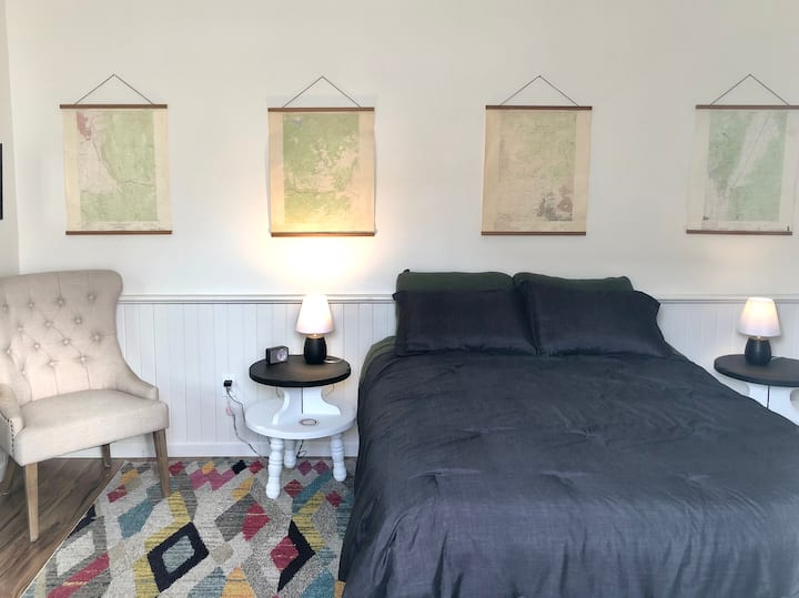 This is the Map Room which includes a queen sized bed as well as a secondary exit.