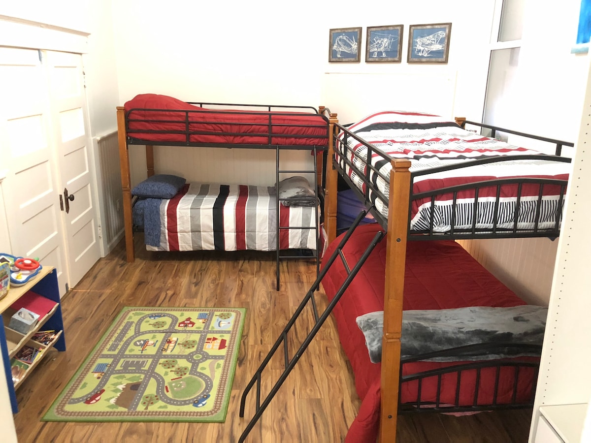 The kids room includes bunk beds for four people.