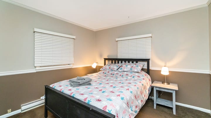 First floor bedroom with queen bed and new mattress. Nightstands have built in charging portals for USB/plugs