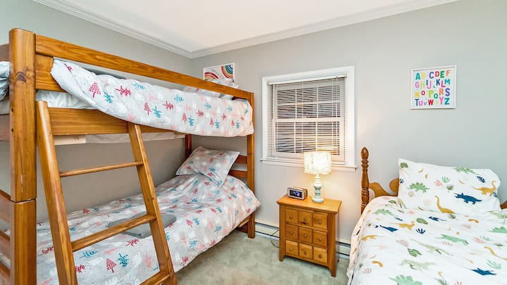 First floor kids bunk room. 3 single beds, new mattresses