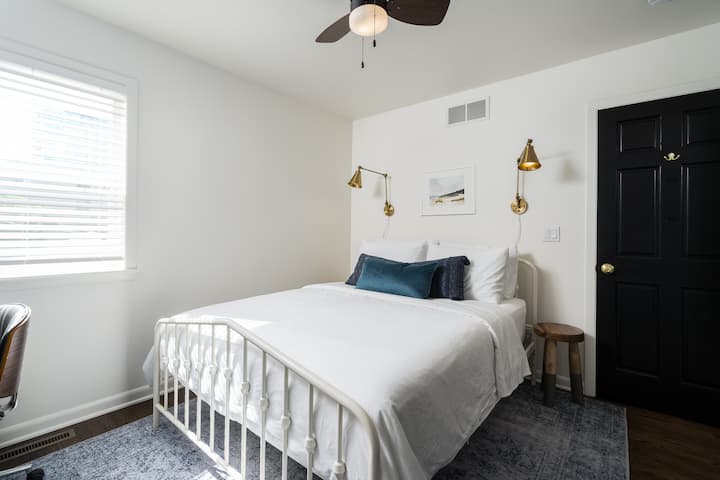 2nd floor bedroom with queen bed, desk, white noise machine and closet 