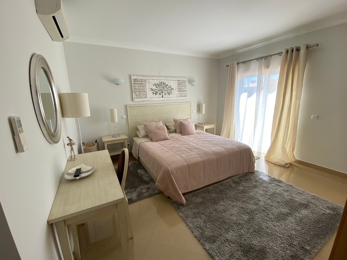 Upper level principal bedroom, two twin beds with a mattress topper giving you dual sleeping options. En suite bathroom. Large wardrobe with  drawers and lots of hanging space. A/C, TV and electric shutters for a darkened and serene place to relax.