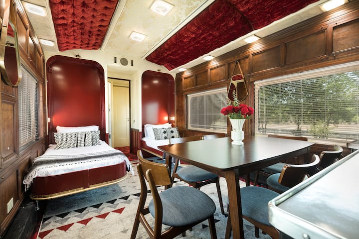 Surprise! The dining room becomes a bedroom with two twin murphy beds. The lightweight dining table comes in handy here.