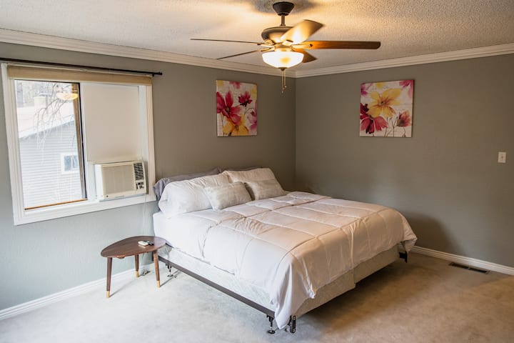 Master Bedroom, upstairs featuring its own huge bathroom with soaking tub, and tiny A/C which keeps the room surprisingly cool.