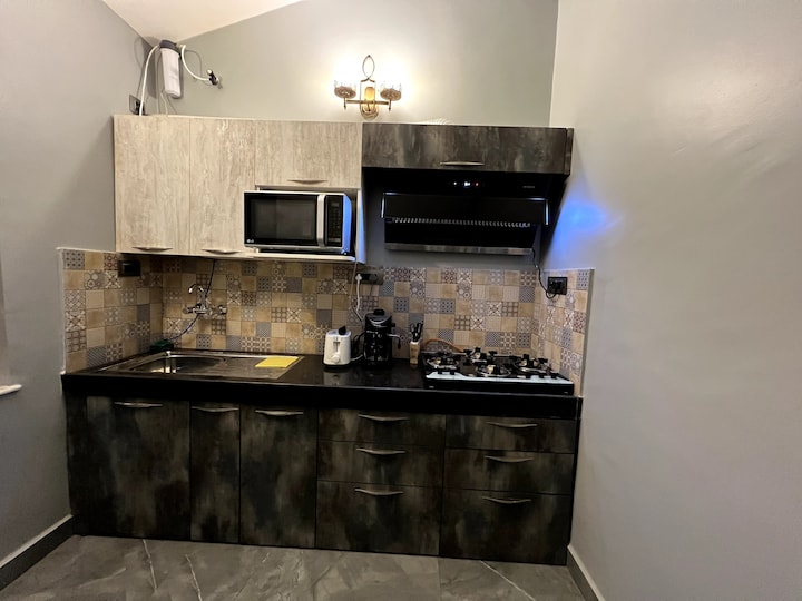 Modular Kitchen fully equipped for cooking with utensils and cutlery