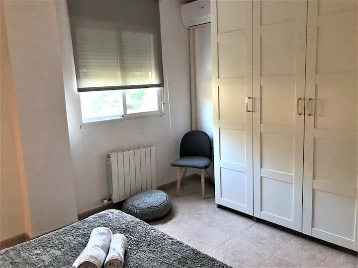 Bedroom closet with queen bed