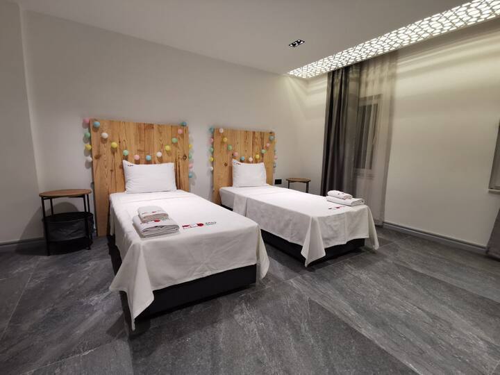 Two double beds located IN the red premium VIP villa