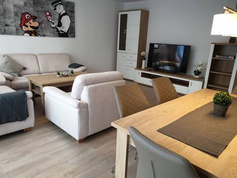 Space for 4, 1 shower, 1 guest toilet, train station around the corner.