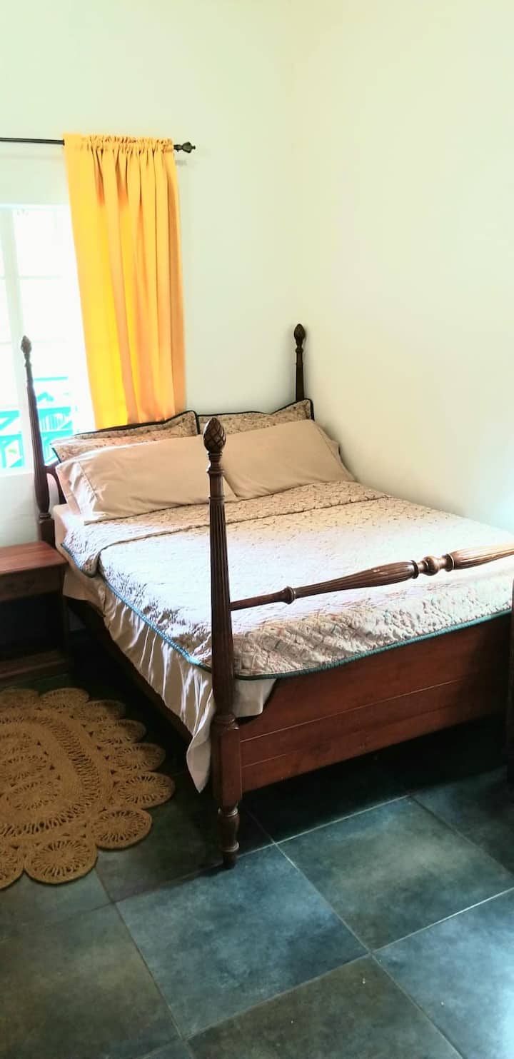POSSIBLE RENTAL AT ADDITIONAL COST.  This is your sunny bedroom.  The drapes are thick and the window faces West so in the morning it's dark, in case you want to sleep in.  Or you can open the curtains and have a glorious view down the Cascade Valley.  Bed is a high quality antique. 