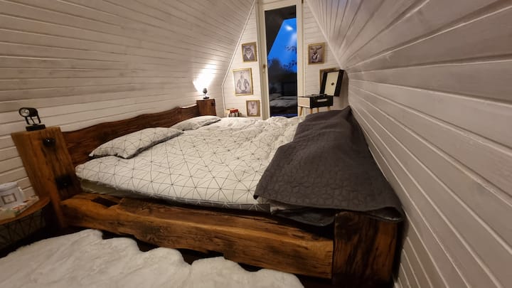 This is the most comfortable king size bed you'll ever sleep in. Custom made from our old farm wood, with its own balcony and a view to die for. Please don't.