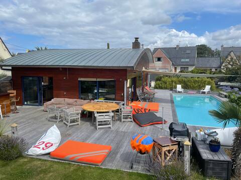 Wooden architect's house with a pool