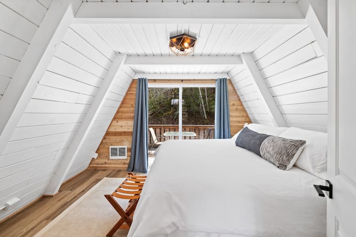 2nd floor bedroom with King Sized bed, coffee station and private outdoor patio.