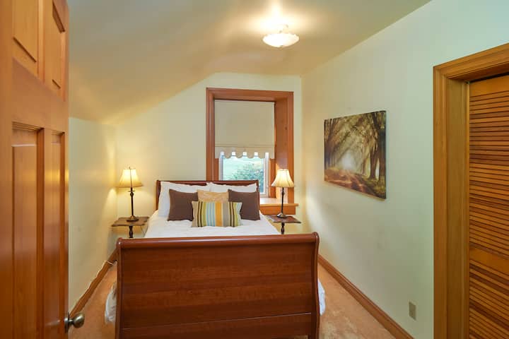 Upper level Double Sleigh bed. Located across the hall from the Bathroom 