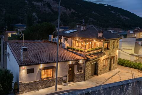 cottage complex with a heated pool