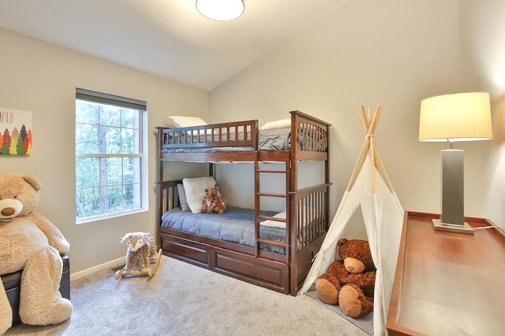 Bedroom #4 features a bunkbed, blackout curtains and dresser that could double as a changing table.  There are children's books, toys and a kid's teepee - perfect for playtime imaginations!