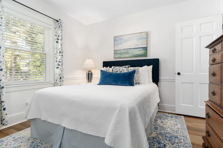 Cozy bedroom with Queen Bed, closet and dresser to store belongs.  Bedroom has a mirror to help getting ready and a chair to assist with dressing for the day's activities.
