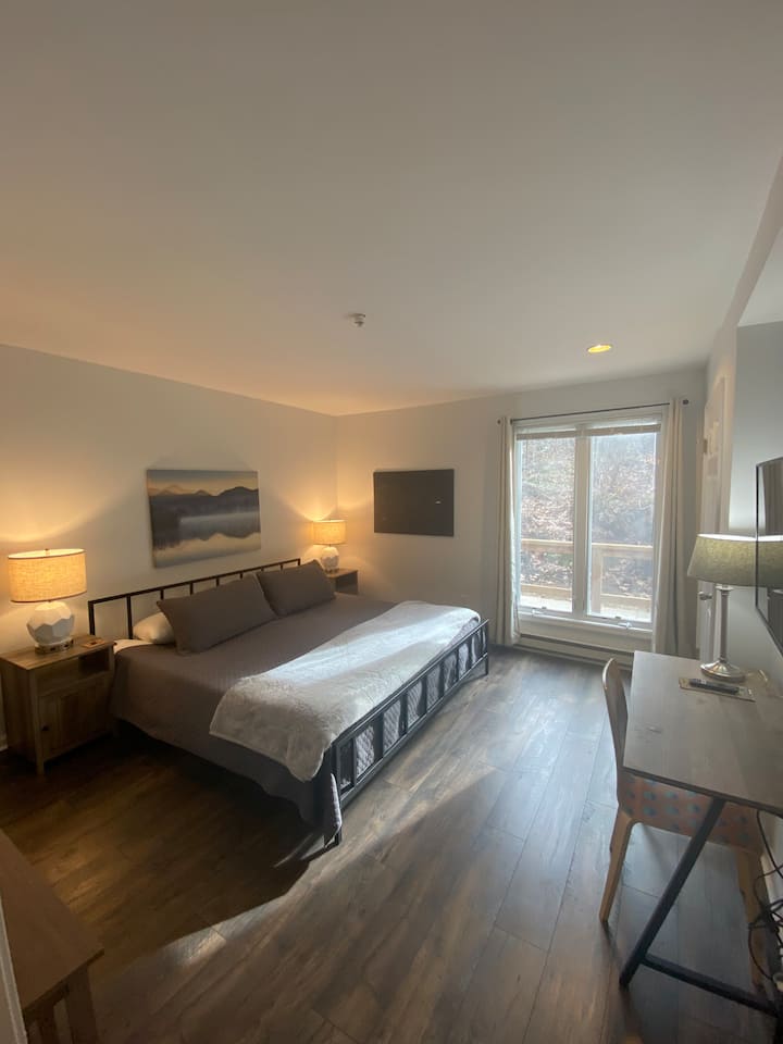 Bedroom 2 features a very comfortable, low, & modern king-size bed. Lamps come with individual USB ports & outlets so you can keep all your devices charging at night.
