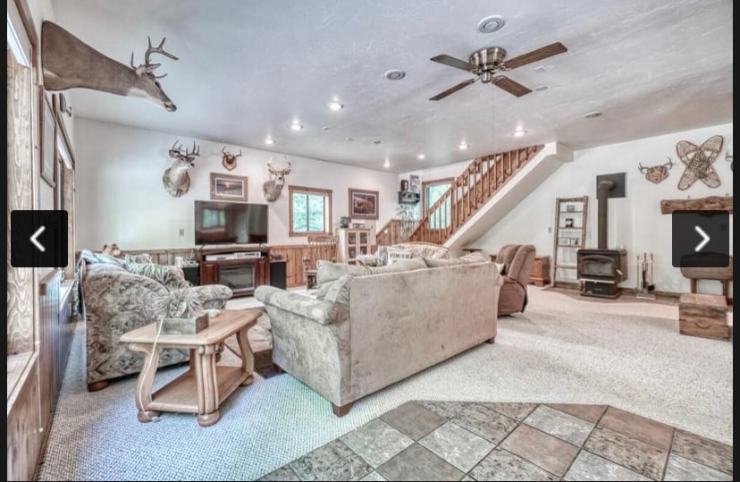 Living room, has ample seating options.  Middle brown couch has a pull out bed option as well.  Tv has Netflix, Disney, and cable TV!