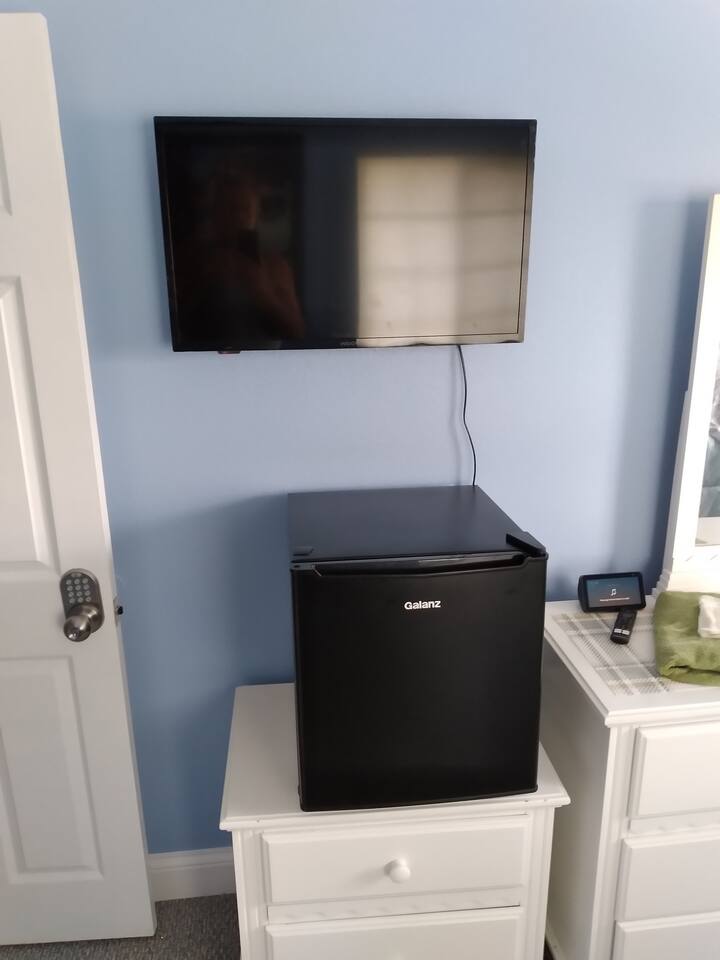 Blue Room mini refrig with TV. Every room has its own mini refrigerator plus a TV. These are Amazon TV. The section that says FREE is where you can watch movies and TV shows. 
