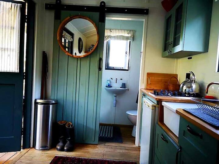 Shepherds Hut surrounded by apple orchards