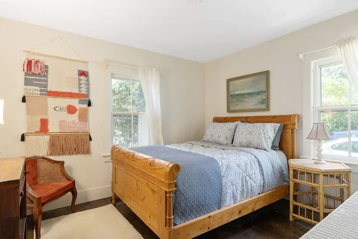 Guest bedroom located on the first floor.... with fresh sheets and tons of natural sunlight you will wake up ready to start you day! 