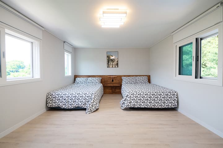 (Bedroom 1) This is a large room with two queen-sized beds.