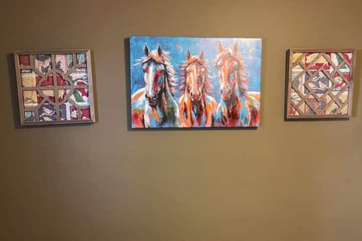 Admire quilted wall hangings on  Country Quilt Cottage walls. The side wall hangings are hand made using old quilt peices by our local designer Scott Brents. Founder and owner of Fairy Tale Florals on JFK Blvd, NLR
