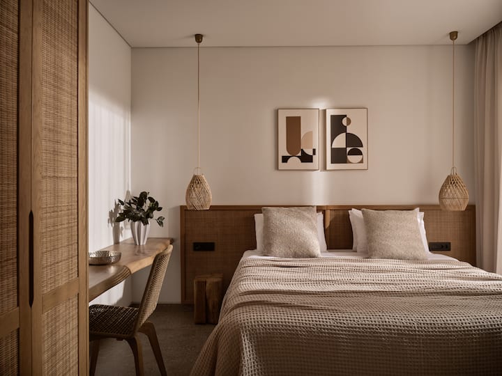 Ground Floor bedroom featuring a double bed with access to a balcony.