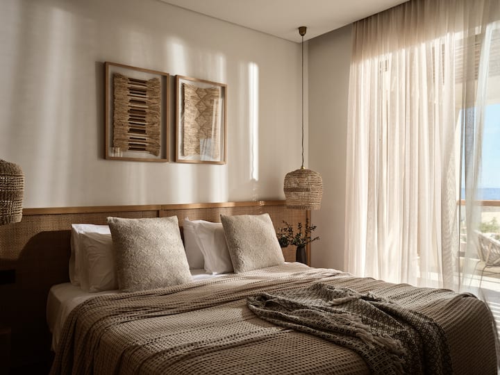 The balcony of the master bedroom features partial sea views.