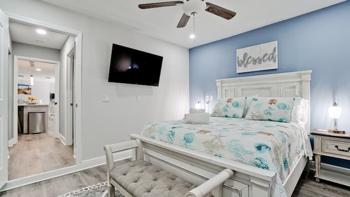 Bedroom 4 next to a bathroom. This inviting bedroom offers a restful haven with modern amenities and a touch of coastal elegance.
