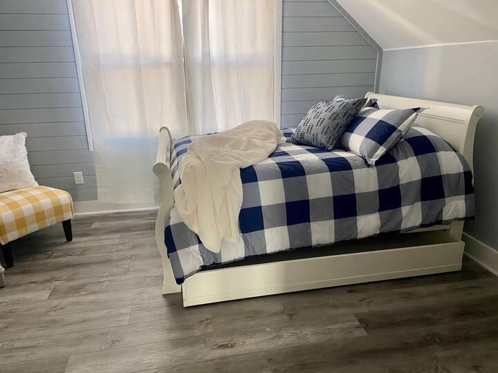 2nd floor bedroom (full) with trundle bed. We have a full size Serta blow up mattress that fits inside or it can be placed any where in the room. In fact, it can be placed anywhere in the house where there is space. It's extremely comfy!