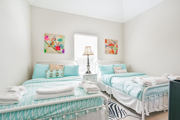 Queen beds in game room 