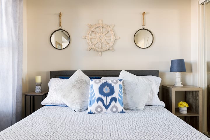 The Blue Nautical Bedroom with Luxome luxury sheets and QUEEN size Purple mattress bed. Stadium Oasis Glendale, Az
