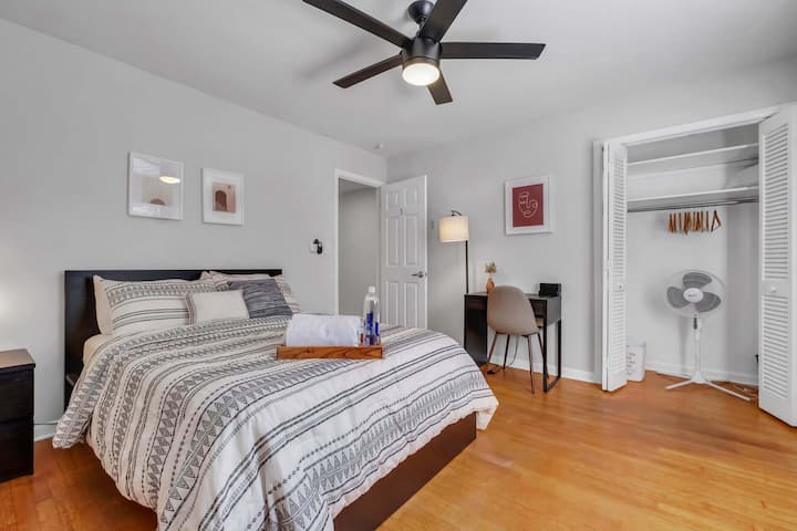 Bedroom #5 comes with a full-size bed, work desk, TV, nightstand, and dresser. You'll find some more creature comforts like a floor fan in the closet.