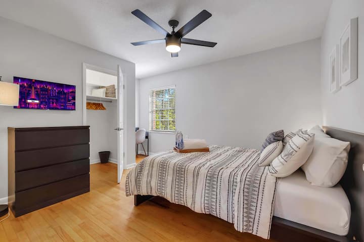 Bedroom #3 comes with a full-size bed, dresser, TV, nightstand and a work desk.