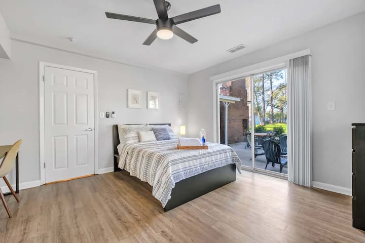 Bedroom #2 comes equipped with a full-size bed and lovely views of the lush backyard space to wake up to.