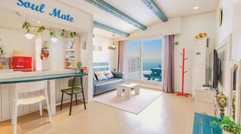 A beautiful yellow mate pension with a Namhae Sea