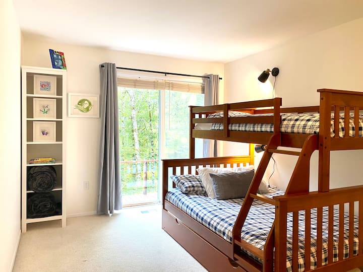 The bunk bed room features a twin XL over full XL bed as well as a twin pull out trundle. 