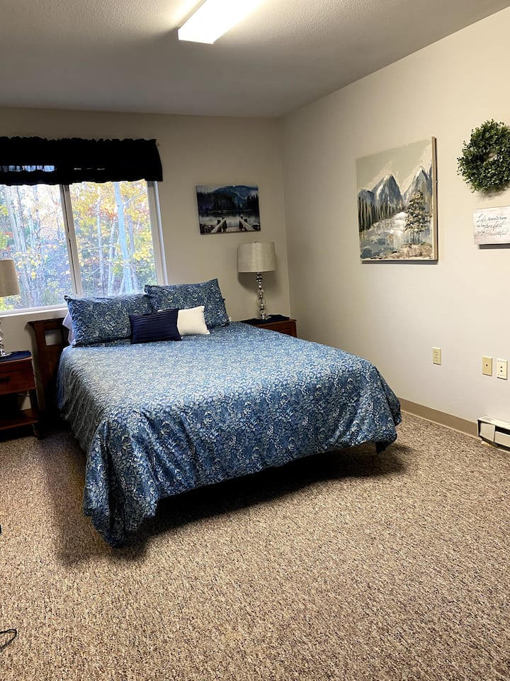 Tranquil Waters (room 3) is one of 2 queen rooms in the east wing.  It has a half bath, small sitting area, closet, and a TV.  It's approximately 10x18, so there's plenty of room for a pack-n-play or twin guest mattress (provided).