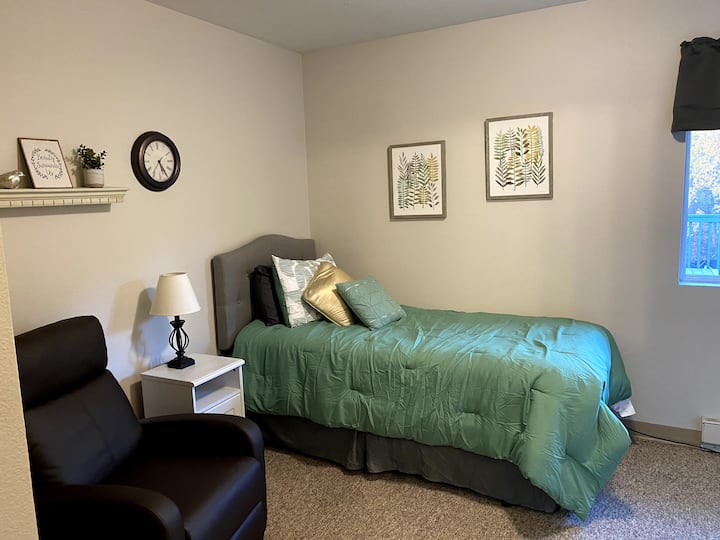 Green Thumb (4, twin) is in the south wing, and has a comfortable recliner set up to see the TV.  This room has a half bath (toilet and sink), closet, dresser, and television that can be seen from the bed and recliner.  