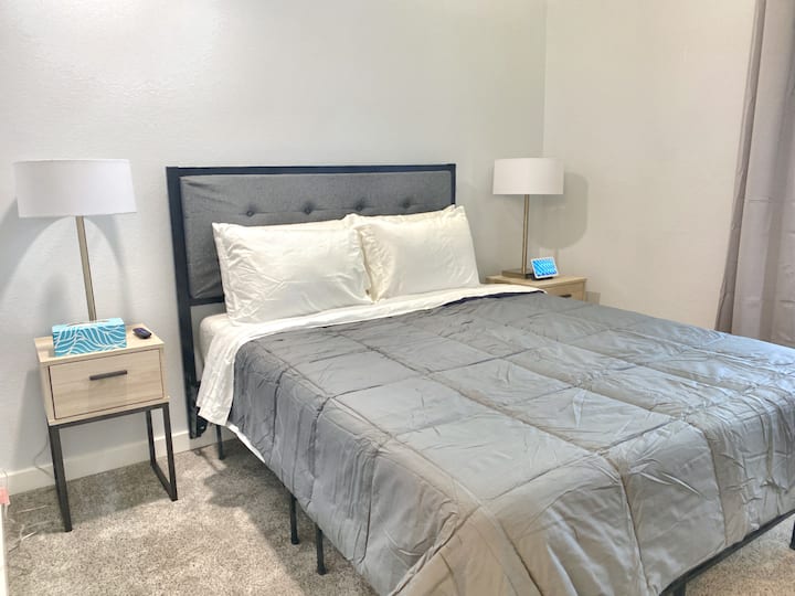 Main floor bedroom fitted with a queen bed. 