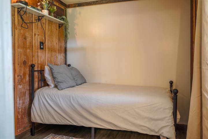 Twin Bedroom This room has curtain entrance to the kitchen area. it's the only sleeping area that does not have a door that closes.