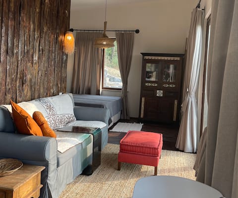 Small chalet with a terrace overlooking the valley and the lake