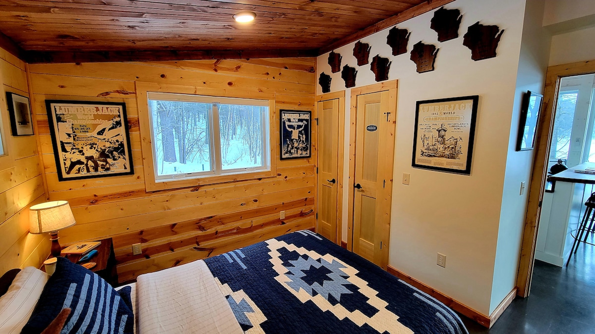 The second bedroom has a queen sized bed, nice lighting, and some very cool "Lumberjack World Championships" memorabilia