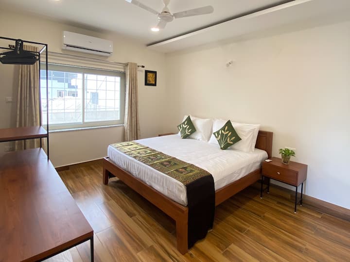 The bedroom comes with an attached bathroom and a huge window for natural sunlight.