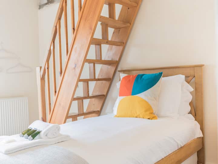 Eenpersoonskamer op de bovenste verdieping