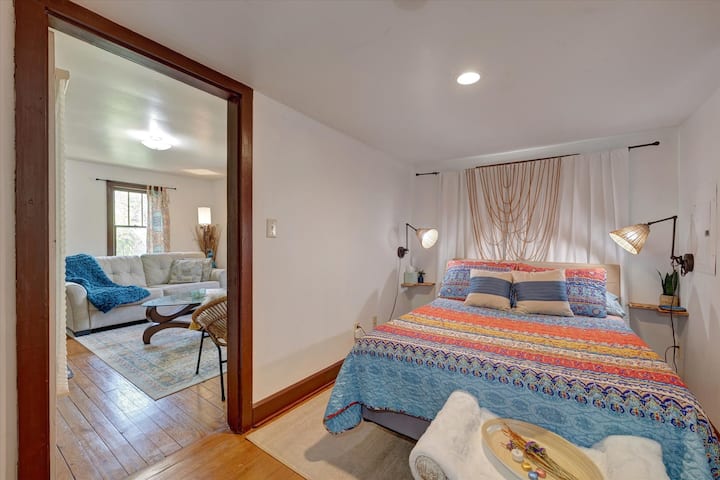 Smaller BR: Get a good night's rest in the full-size bed with comfy memory foam mattress top, plush pillows, and soft sheets. Room-darkening curtains, a dresser in the closet, and a drop-down desk in the alcove are provided for your convenience.