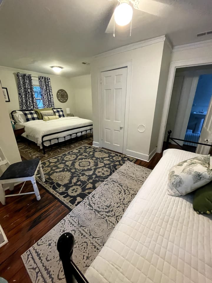 This used to be two rooms and a previous owner took down the wall between them to make it a larger bedroom. So there is a king size bed and a twin daybed with a trundle that can sleep 1-2.