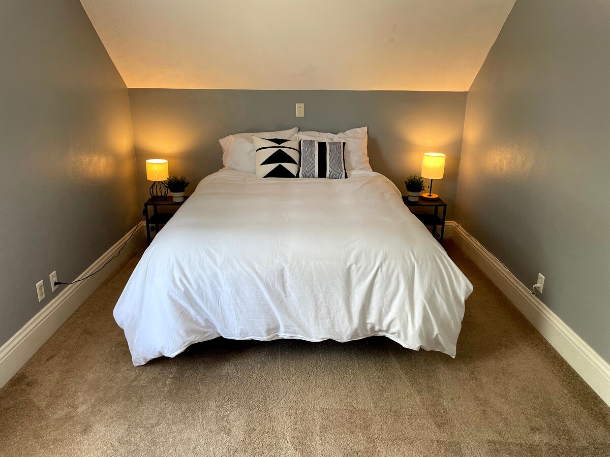 Bedroom #1 includes a queen bed and desk.