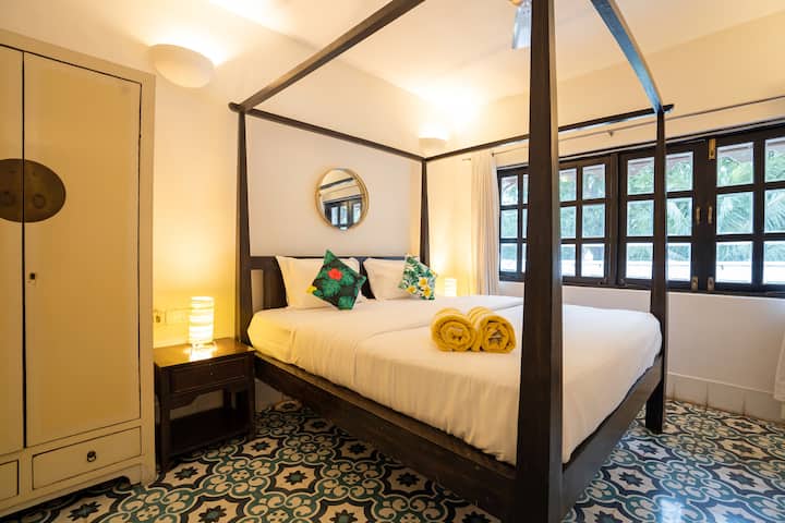 Luxurious King size bed with comfort. Pool side view. Attached bathroom and a spacious wardrobe